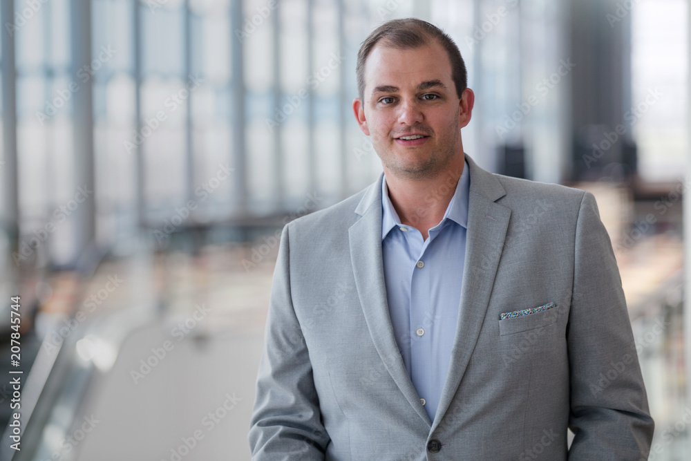Fototapeta premium American business corporate sales person portrait in large building hall