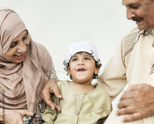 Muslim grandparents with their grandchild photo