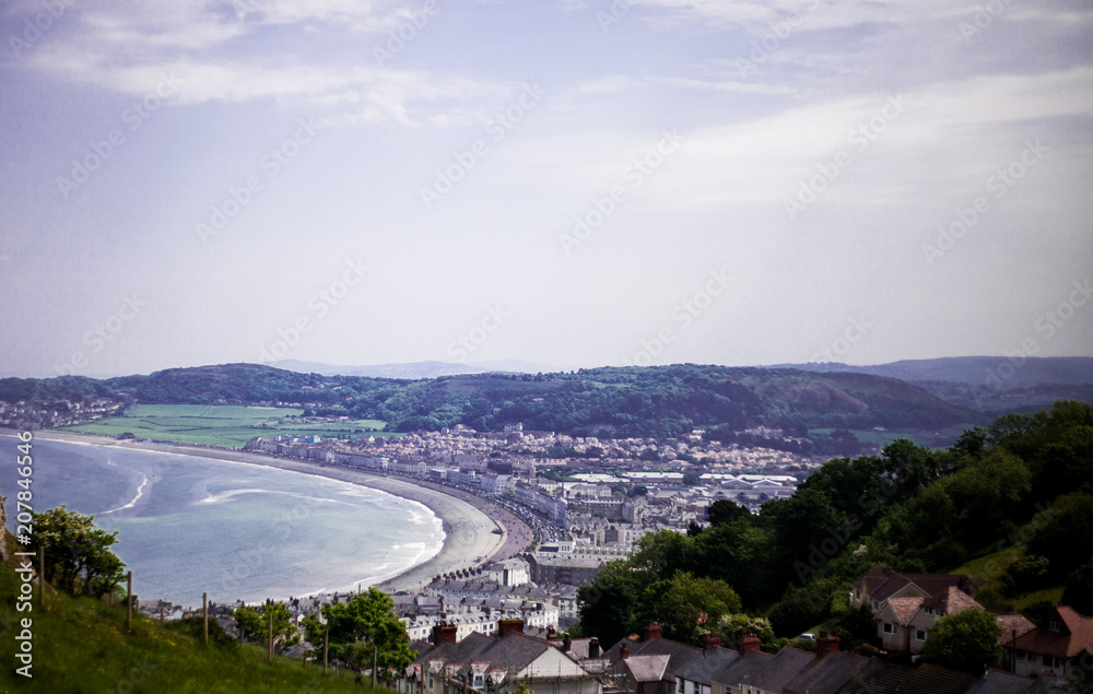 Llandudno Sea Front North Wales, United Kingdom. View of beach in a beautiful summer day, United Kingdom. Views from the Great Orme. Photo shoot from the top of Conwy mountain to Llandudno