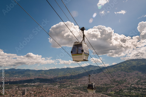 Medellin cable car with city in background on a sunny day. Medellin Colombia