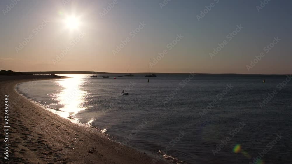 A wide shot of a white sand and a blue sky. A wide shot of a white sand and a blue sky.