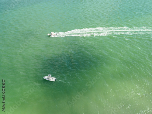 beach aerial drone above view white sand boats sea water island © Sam Foster