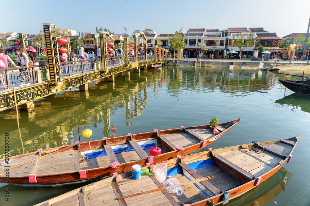 Tourist wooden boats and scenic bridge, Hoi An Ancient Town