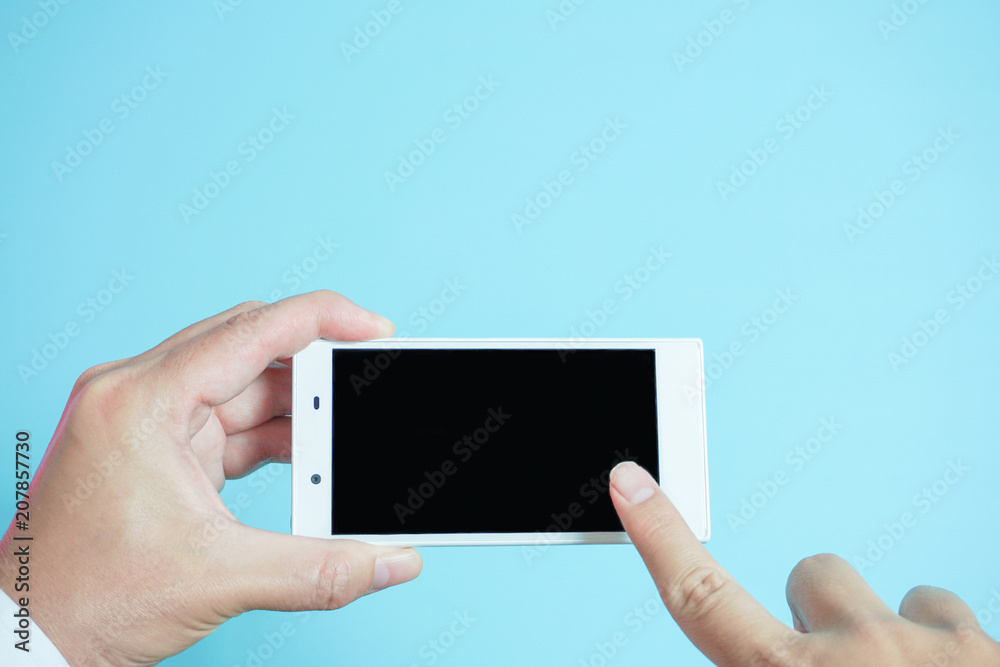 Using mobile phones in business scene.. スマートフォンを使う 水色背景 Using mobile phones in business scene.. スマートフォンを使う 水色背景