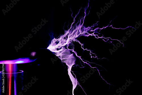 Tesla Coil, Electrostatic Discharge spark, lightning on black background  photo