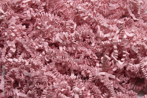 Pink shredded craft paper background