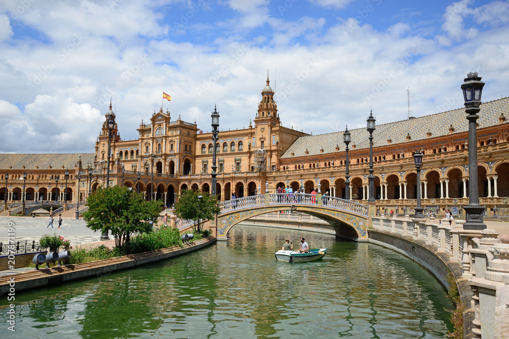 Fototapeta premium Seville, Spain - May 25, 2018: Plaza de España with the building of the National Geographic Institute in the background.