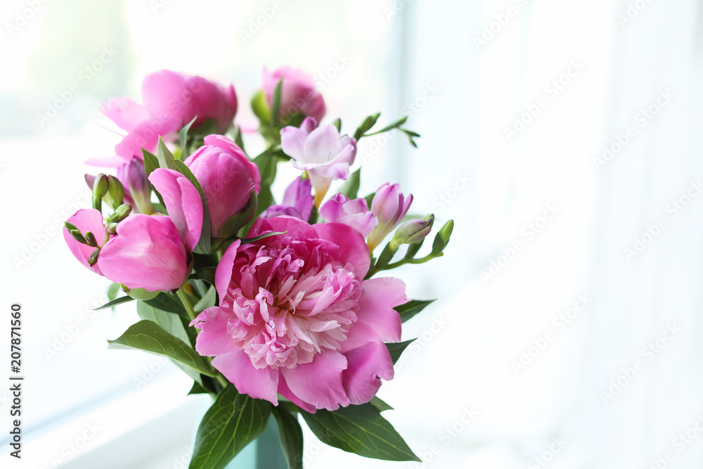 Vase with beautiful peony flowers on windowsill indoors