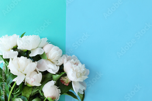 Bouquet of beautiful flowers on color background, top view