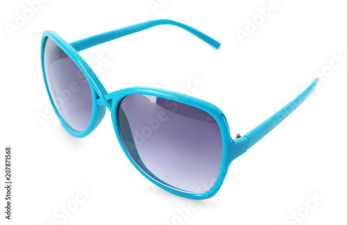 Beautiful sunglasses on white background. Beach object
