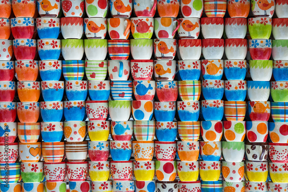 Colorful patterns of ceramic cups for the background.