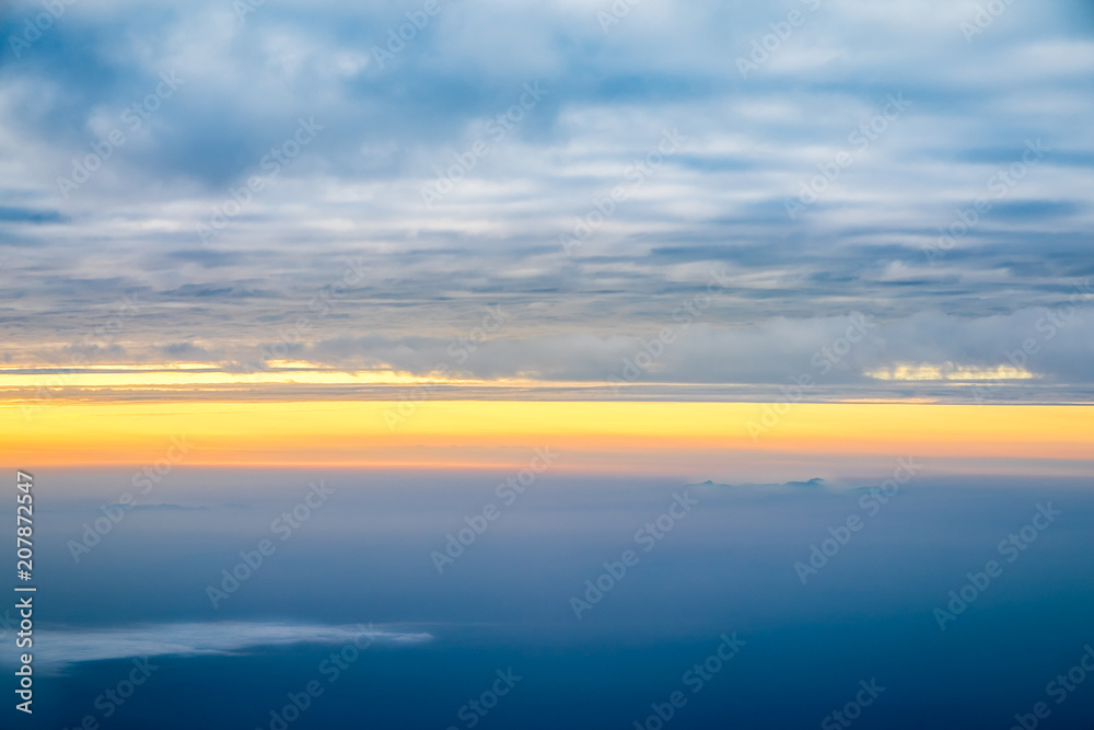 Obraz premium View sunset with sky and cloudy from airplane window when flying,Nature background.