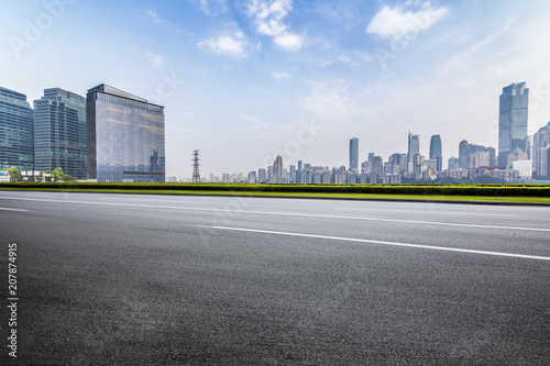 Panoramic skyline and buildings with empty road