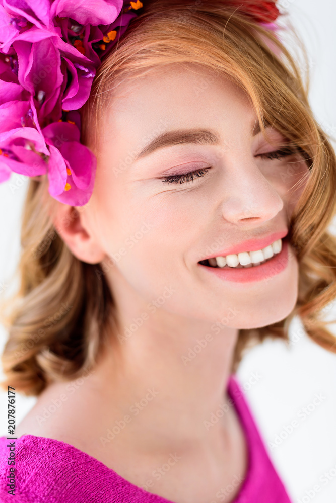 close-up portrait of beautiful young woman in floral wreath smiling with closed eyes close-up portrait of beautiful young woman in floral wreath smiling with closed eyes
