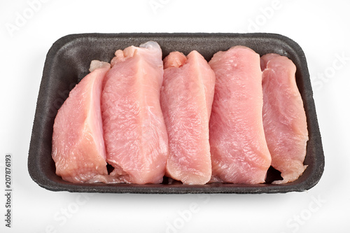 Raw dietary turkey meat pieces in tray, isolated on white background