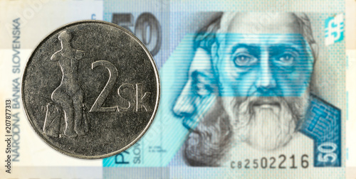 2 slovak koruna coin against 50 slovak koruna banknote obverse photo