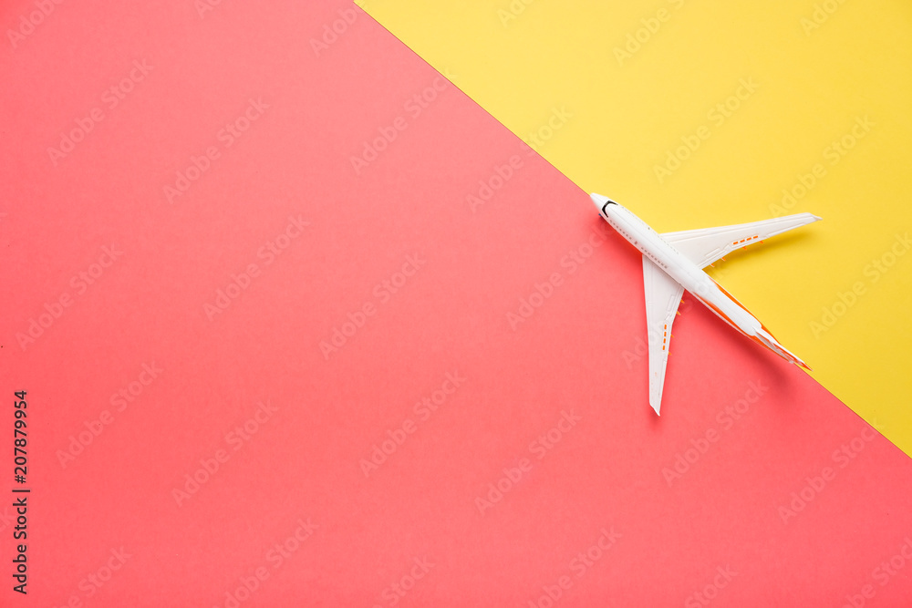Top view of an airplane on trendy color background.  Bright summer color. Travel concept.
