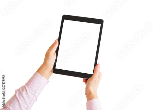 Woman holding tablet vertically in hands with empty white screen.
