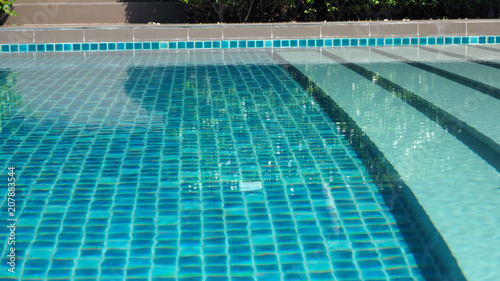 swimming pool water with Pool ladder step