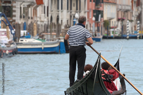 gondolier back wearing a blue marinière