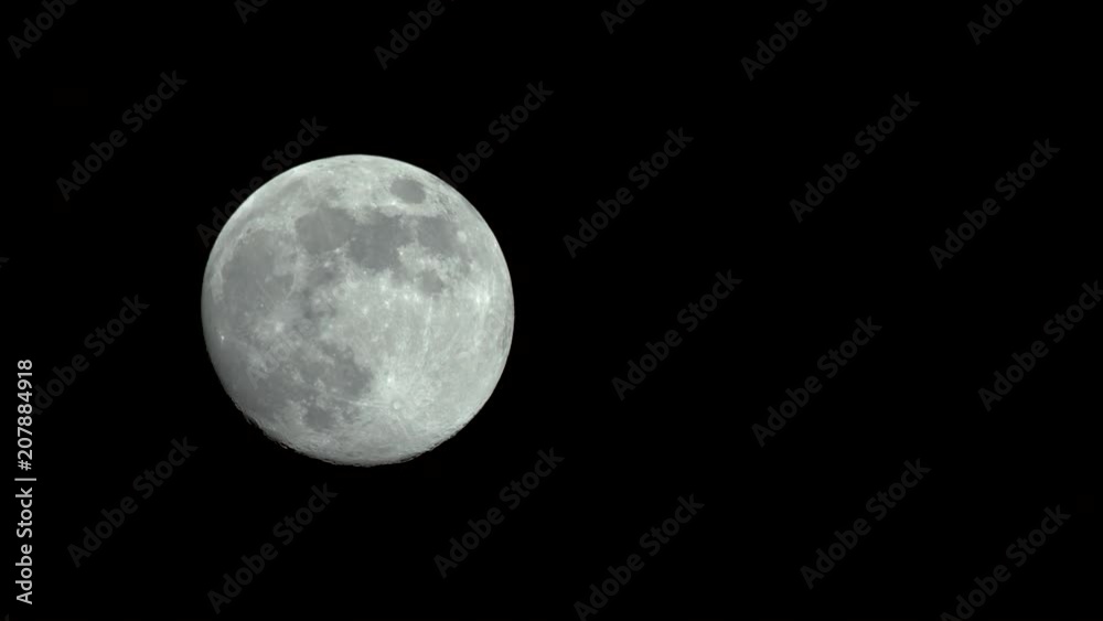 Time-lapse of a full moon moving across the night sky. Shot on a Blackmagic Ursa Mini Pro 4.6k with a Sigma 150-600mm f/5-6.3. Time-lapse of a full moon moving across the night sky. Shot on a Blackmagic Ursa Mini Pro 4.6k with a Sigma 150-600mm f/5-6.3.