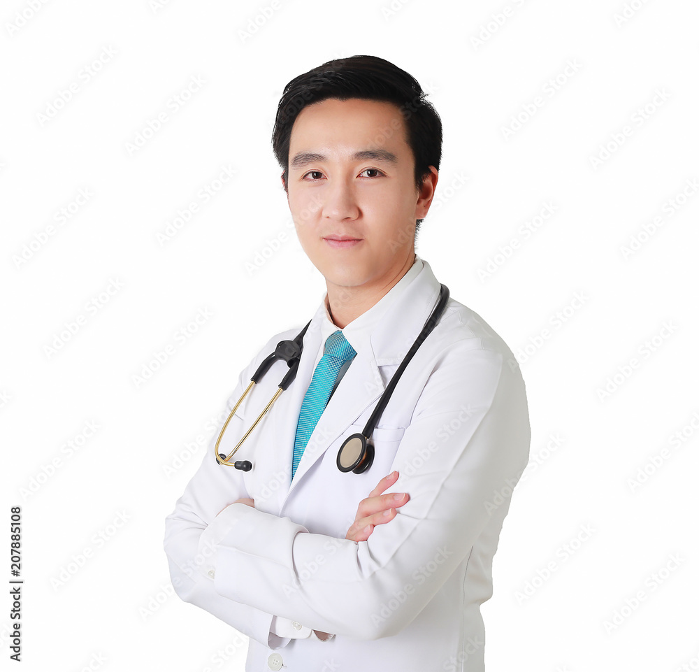 Smart doctor posing with arms crossed, medical staff working on the background. Smart doctor posing with arms crossed, medical staff working on the background.