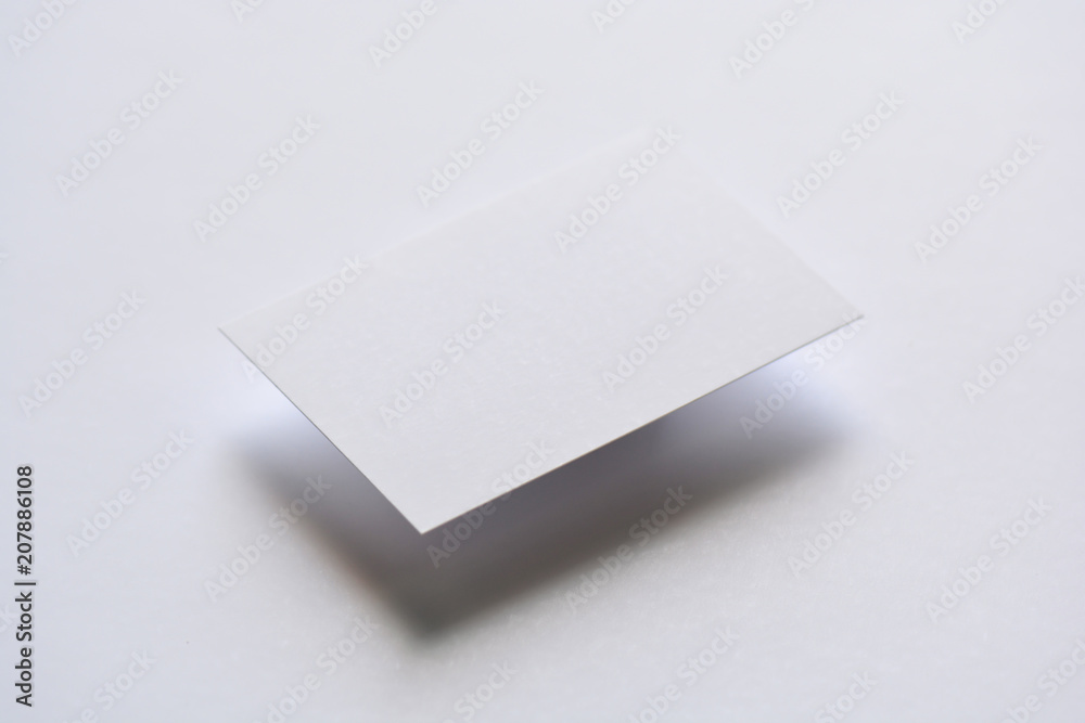 Photo of blank white business cards on white. Mock-up for branding identity. For graphic designers presentations and portfolios Photo of blank white business cards on white. Mock-up for branding identity. For graphic designers presentations and portfolios