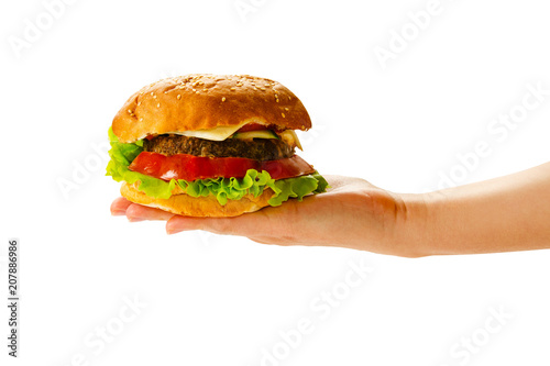 Hand holding burger isolated on white background.