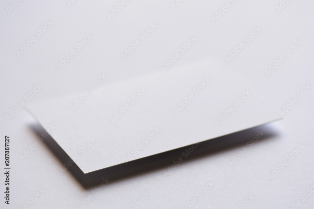 Photo of blank white business cards on white. Mock-up for branding identity. For graphic designers presentations and portfolios Photo of blank white business cards on white. Mock-up for branding identity. For graphic designers presentations and portfolios