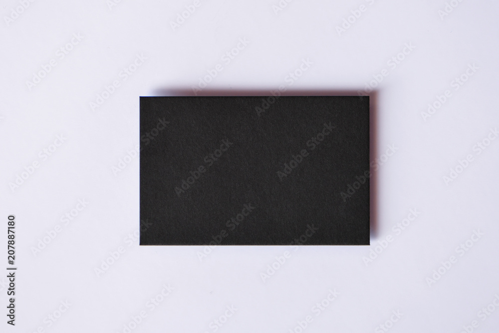 Mockup of blank textured black business card at white background Mockup of blank textured black business card at white background