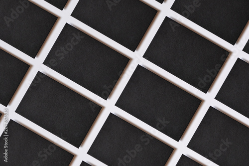 Photo of blank textured business cards on white. Mock-up for branding identity. For graphic designers presentations and portfolios. Business cards stacks arranged in rows at white paper background.