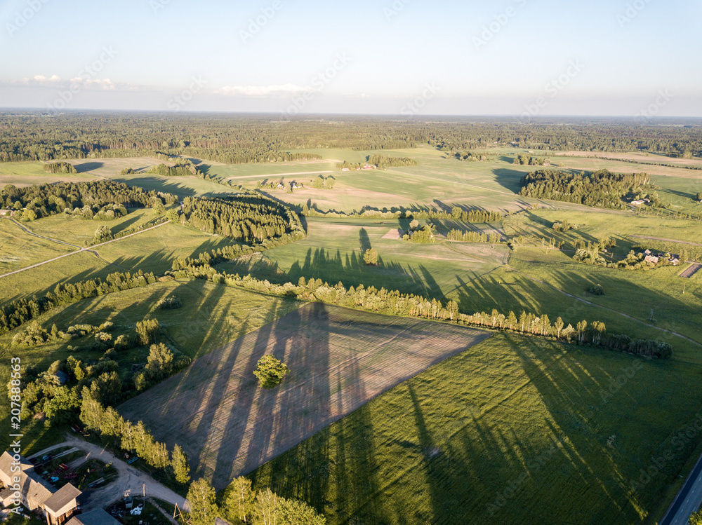 drone image. aerial view of rural sunset with long shadows