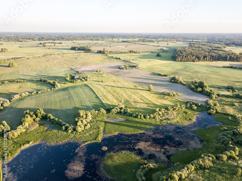 drone image. aerial view of rural area with fields and roads © Martins Vanags