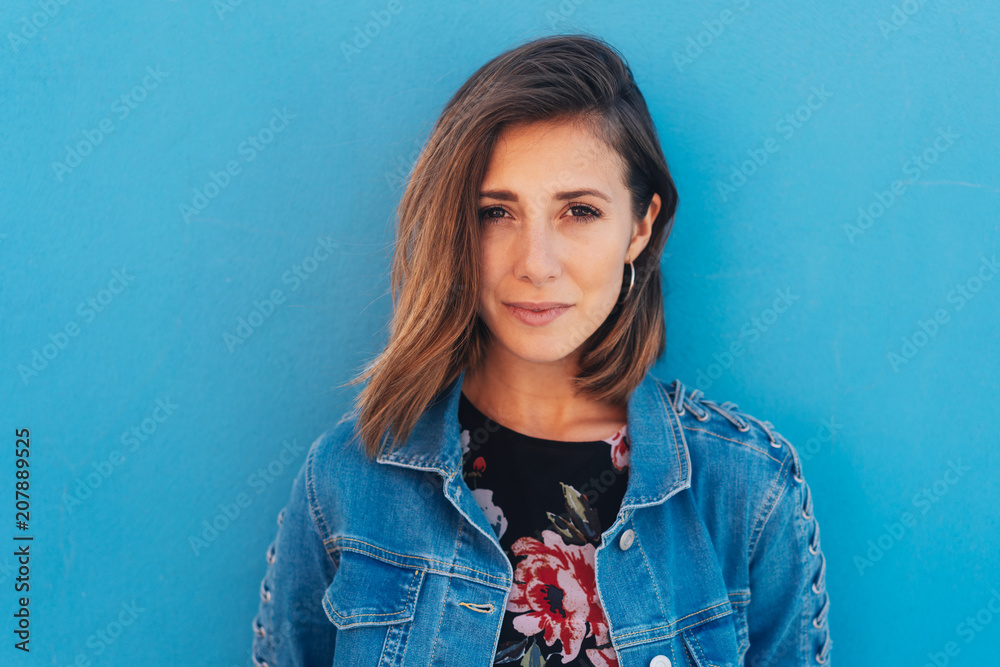 Pretty, young, modern woman with blue copy space Pretty, young, modern woman with blue copy space