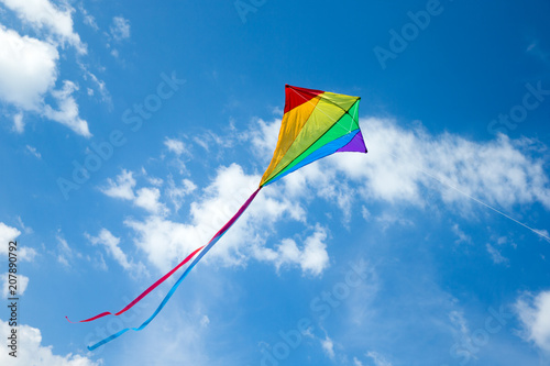 Kite flying in the sky among the clouds photo