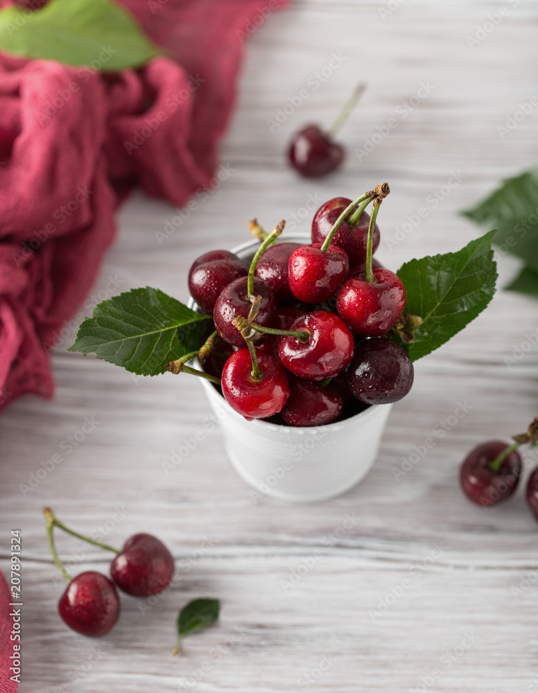 Fresh cherry with water drops on rustic wooden background. Fresh cherries background. Healthy food concept Fresh cherry with water drops on rustic wooden background. Fresh cherries background. Healthy food concept