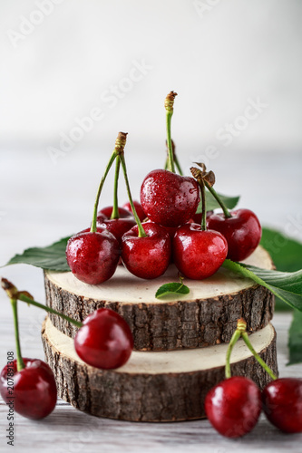 Fresh cherry with water drops on rustic wooden background. Fresh cherries background. Healthy food concept