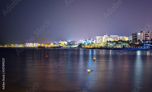 Night cityscape with beachline © frimufilms