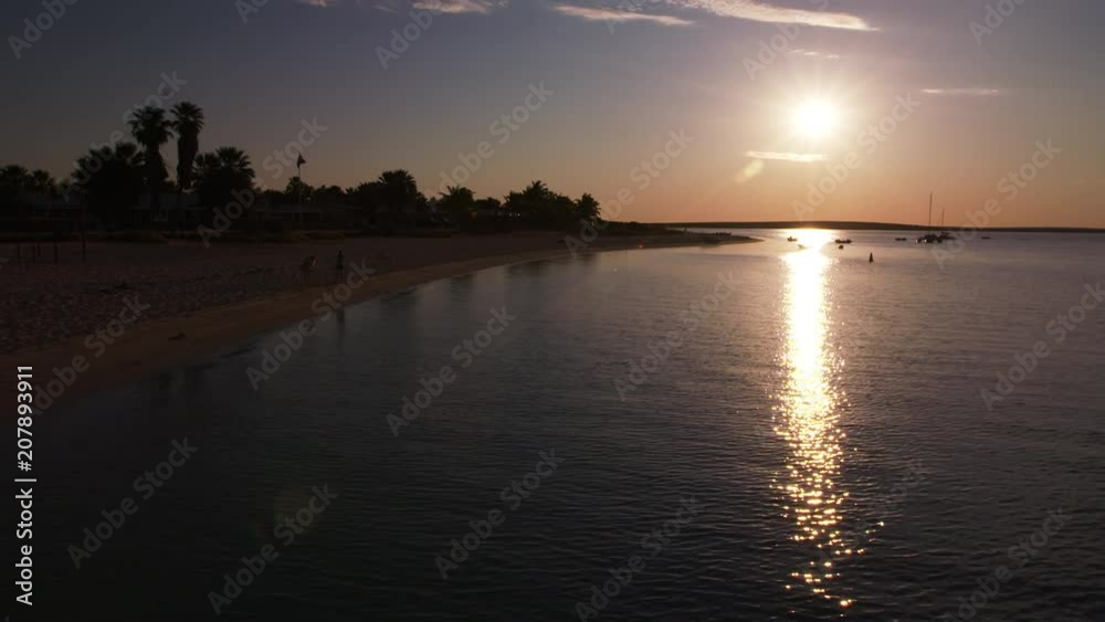 A wide shot of a white sand and a blue sky. A wide shot of a white sand and a blue sky.
