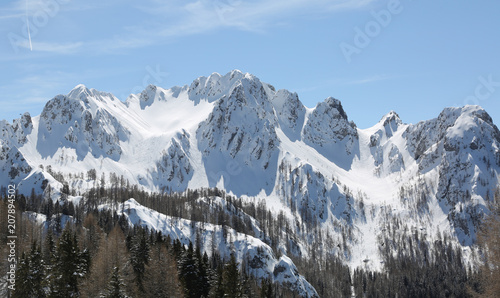 panormaric view of moutains with white snow in winter from Lussa