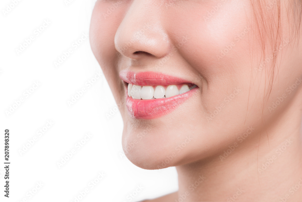 Obraz premium Beautiful smile young woman isolated on white. White teeth.
