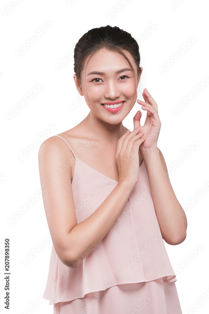 Lovely girl with dark hair and dark eyebrows touching face and looking at camera Lovely girl with dark hair and dark eyebrows touching face and looking at camera