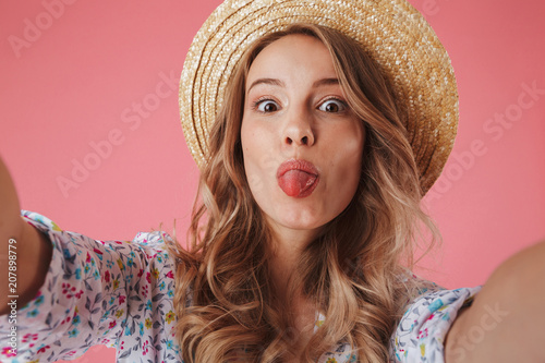 Close up portrait of a cheerful young woman in summer dress