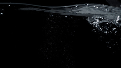 Soda water liquid splashing in black background