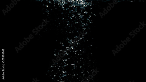 Soda water liquid splashing in black background
