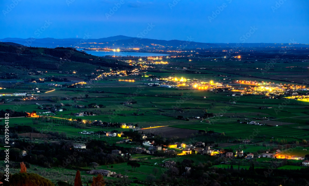 Valdichiana with lake Trasimeno seen from Cortona at night, Tuscany