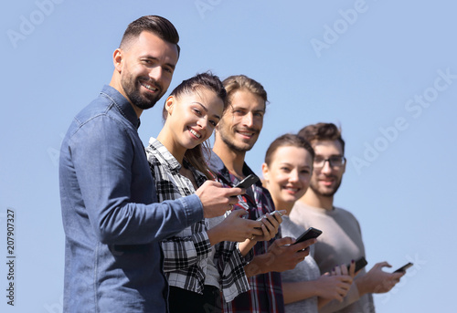 group of young people with modern smartphones.