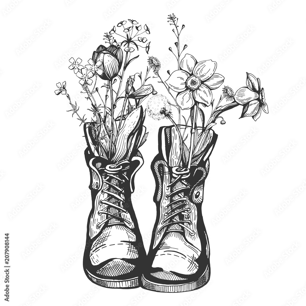 Fototapeta old vintage boots filled with wild flowers