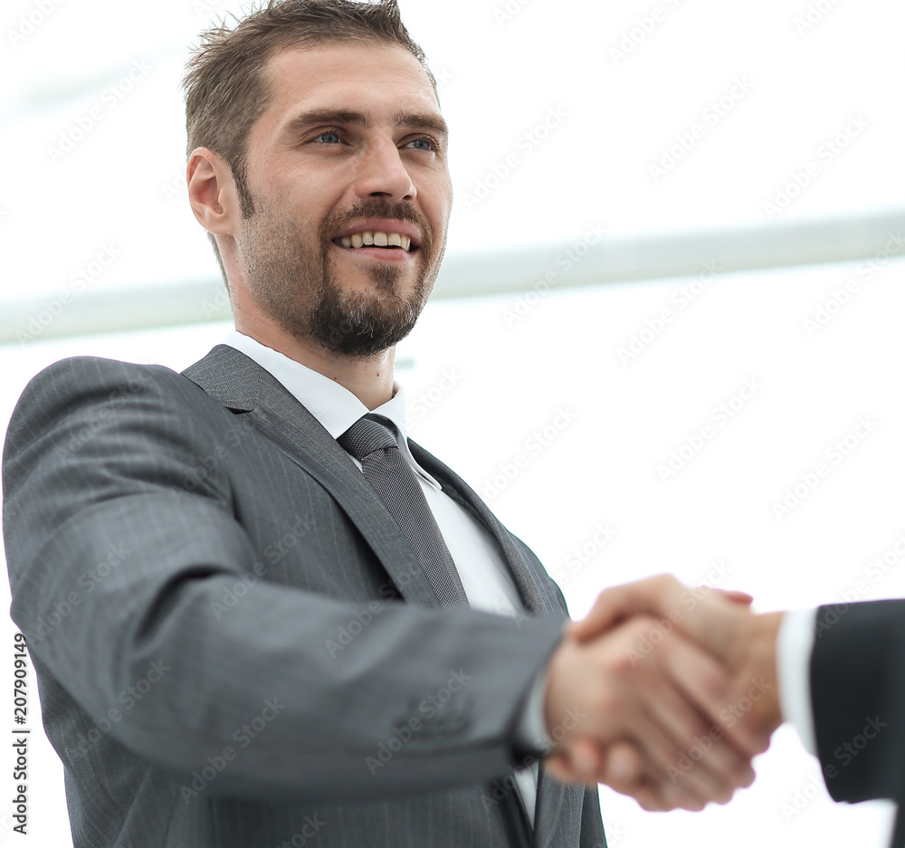 closeup .businessman shaking hands with a business partner. closeup .businessman shaking hands with a business partner.