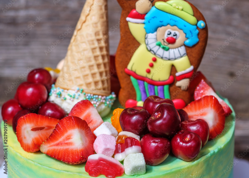 beautiful homemade cake with a funny clown figure